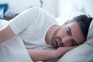 Man lying in bed