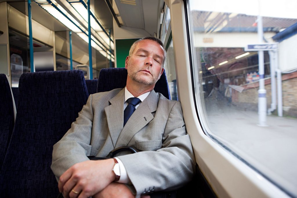 Commuter sleeping on the train