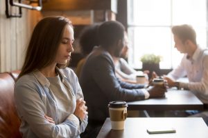 Girl feeling lonely in coffee shop